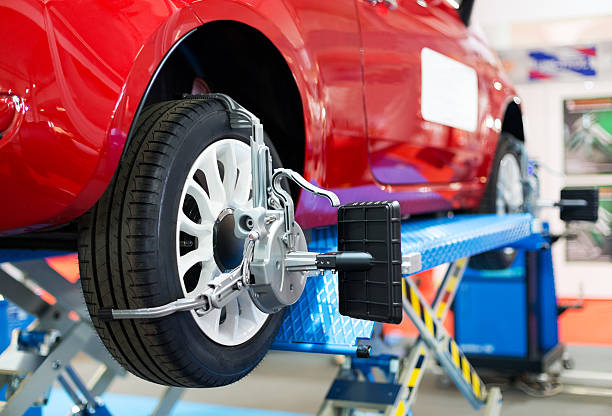 Caster angle of wheel alignment at auto repair shop, copy space