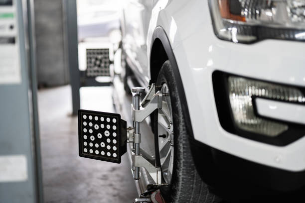 Close up of car wheel alignment in auto repair shop