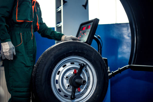 Mechanic man working on balancing machine