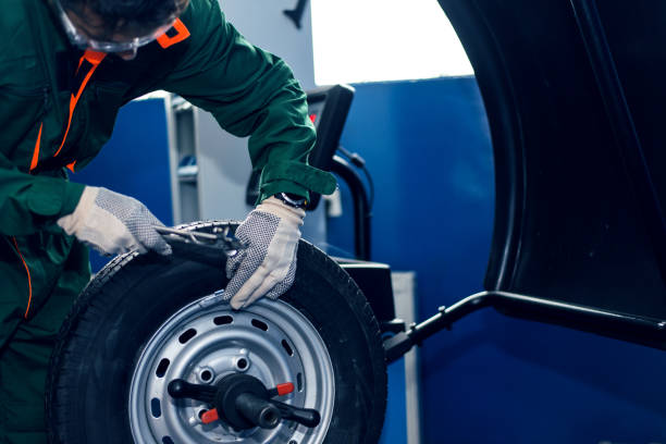 Mechanic removes car tire