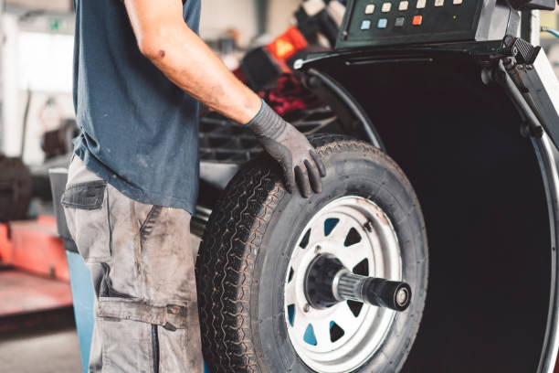 Truing a tire in his work shop